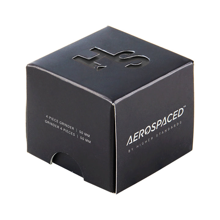 Black 4 piece Aeropspaced grinder inside it's black box