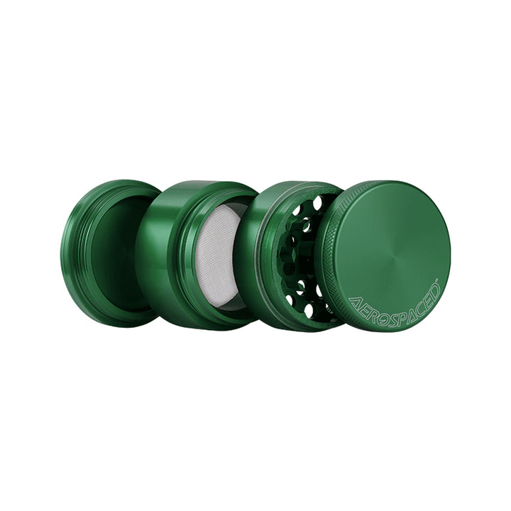 Open Green 4 piece Aerospaced grinder against a white background.