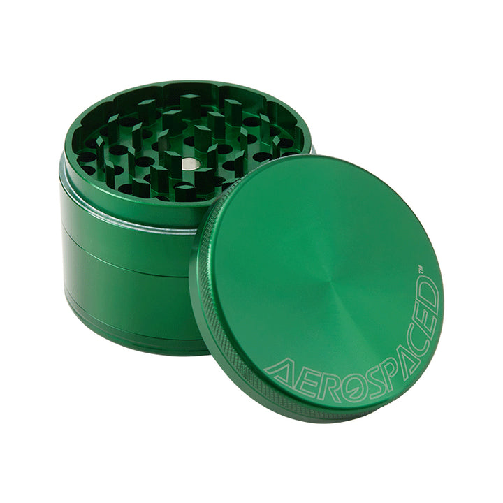 Large green 4 piece Aeropspaced grinder with lid off.