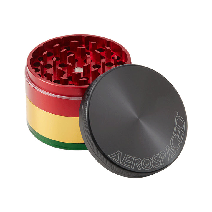 Large Rasta coloured 4 piece Aeropspaced grinder with lid off.