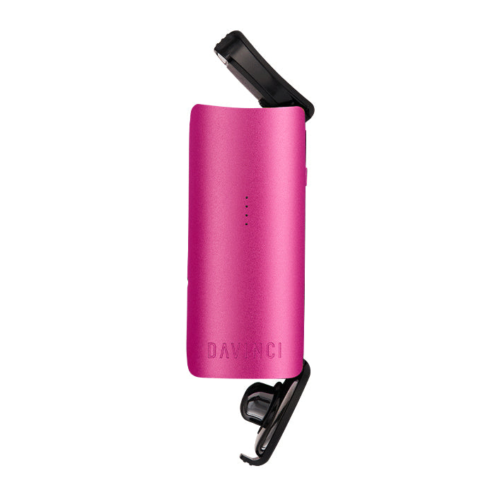 Open compartments of Pink Miqro-C vaporizer against a white background.