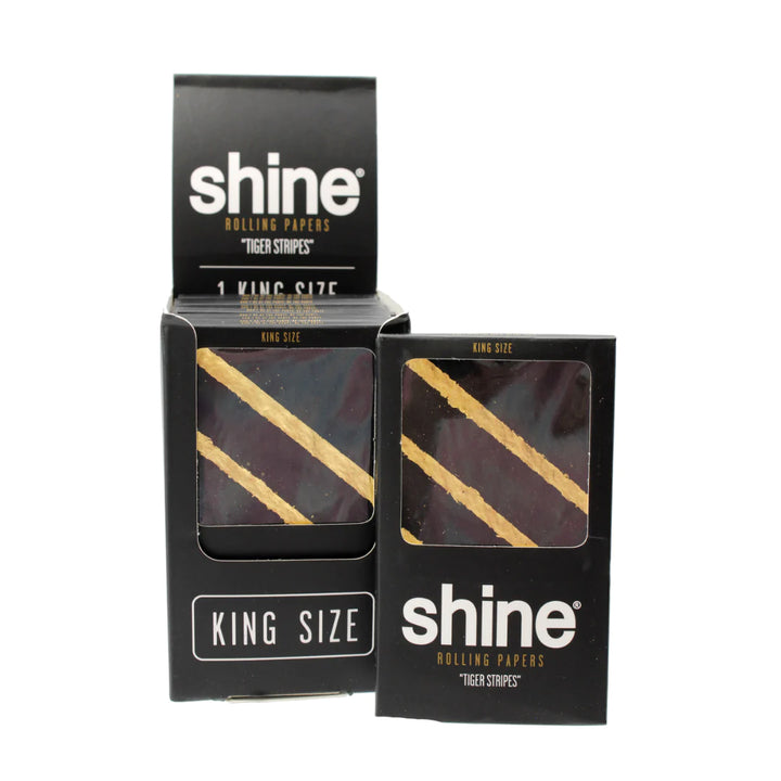 An open box of the Tiger Striped Shine Papers.
