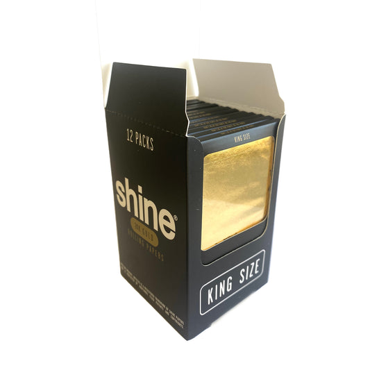 A 12 pack box of the gold Shine 24k rolling Papers.